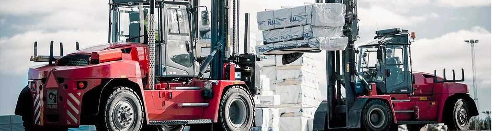 Two kalmar forklifts with heavy loads